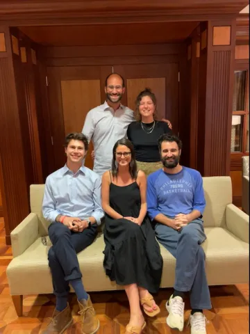 group of people sitting on a couch
